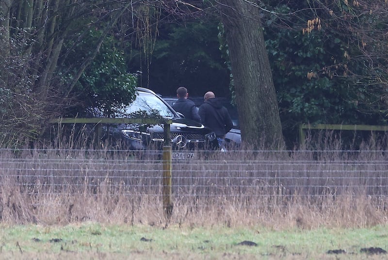 Men step out of an unmarked car at the home of Andrew Mountbatten-Windsor on February 19, 2026 in Sandringham, Norfolk. Andrew Mounbatten-Windsor has been arrested on suspicion of misconduct in public office, following police investigation into the recently release Epstein files. The former prince continues to deny any wrongdoing.