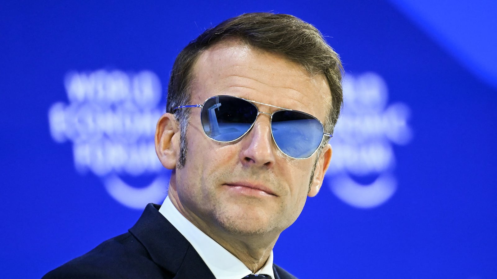 TOPSHOT - France's President Emmanuel Macron looks on during the World Economic Forum (WEF) annual meeting in Davos on January 20, 2026. The World Economic Forum takes place in Davos from January 19 to January 23, 2026. (Photo by Fabrice COFFRINI / AFP via Getty Images)