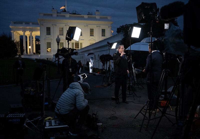 US Secretary of the Treasury Scott Bessent (C) gives an interview to FOX News' anchor Bret Baier outside the West Wing of the White House in Washington, DC on November 18, 2025.