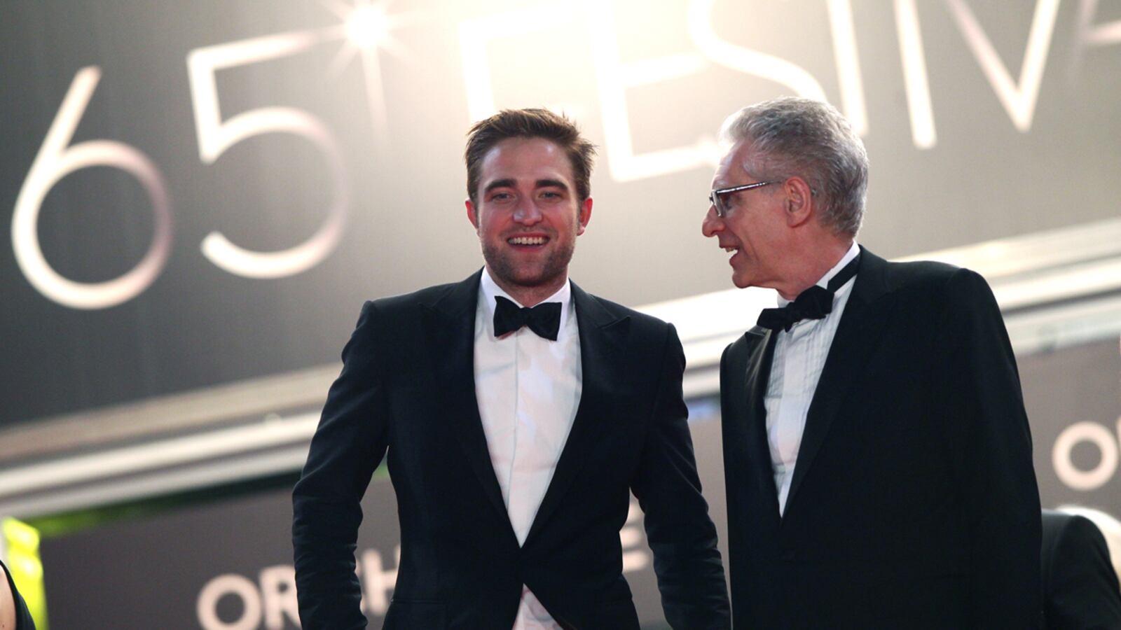 articles/2012/05/27/the-crush-for-cronenberg-s-cannes-competition-entry-cosmopolis/pattinson-cronenberg-cannes-porton_djfiqp