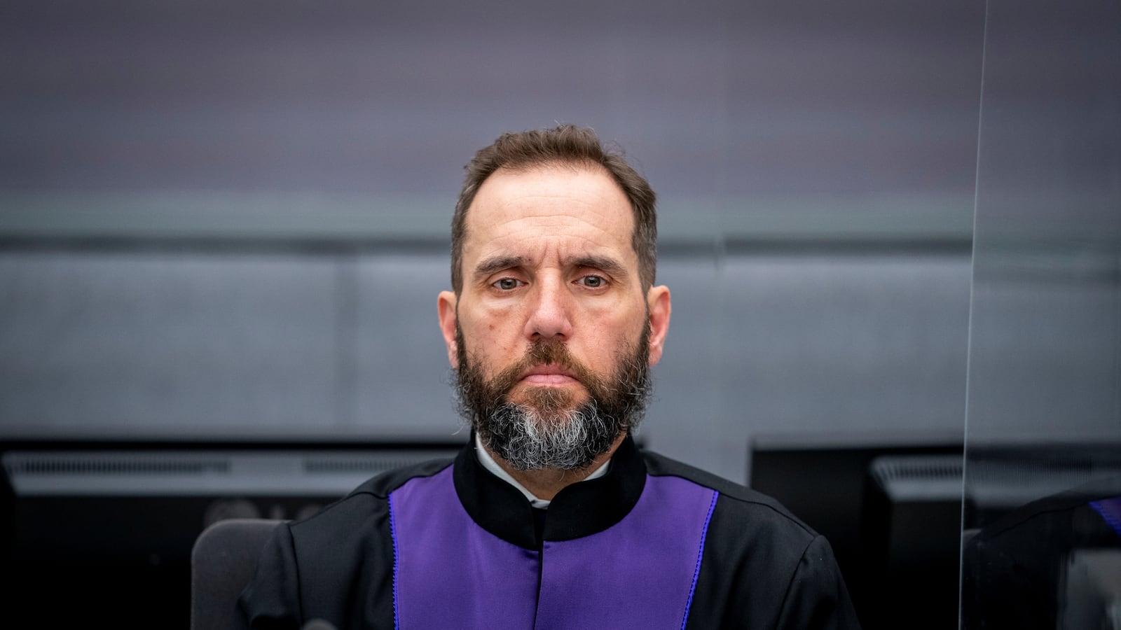 Jack Smith stares forward during a hearing in the Netherlands.