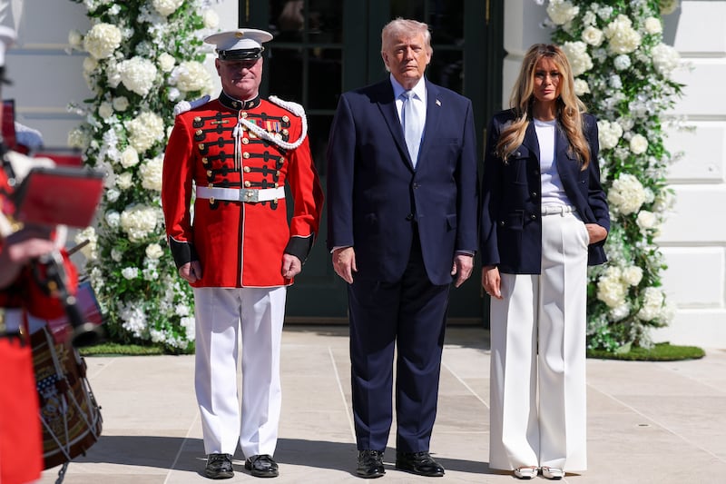 WASHINGTON, DC - APRIL 06: U.S. President Donald Trump and first lady Melania Trump arrive to greet guests a the White House Easter Egg Roll on April 06, 2026 in Washington, DC. The Easter Egg Roll is a White House tradition dating back to 1878. The Trumps also honored the 250th anniversary of the United States during the event. (Photo by Anna Moneymaker/Getty Images)