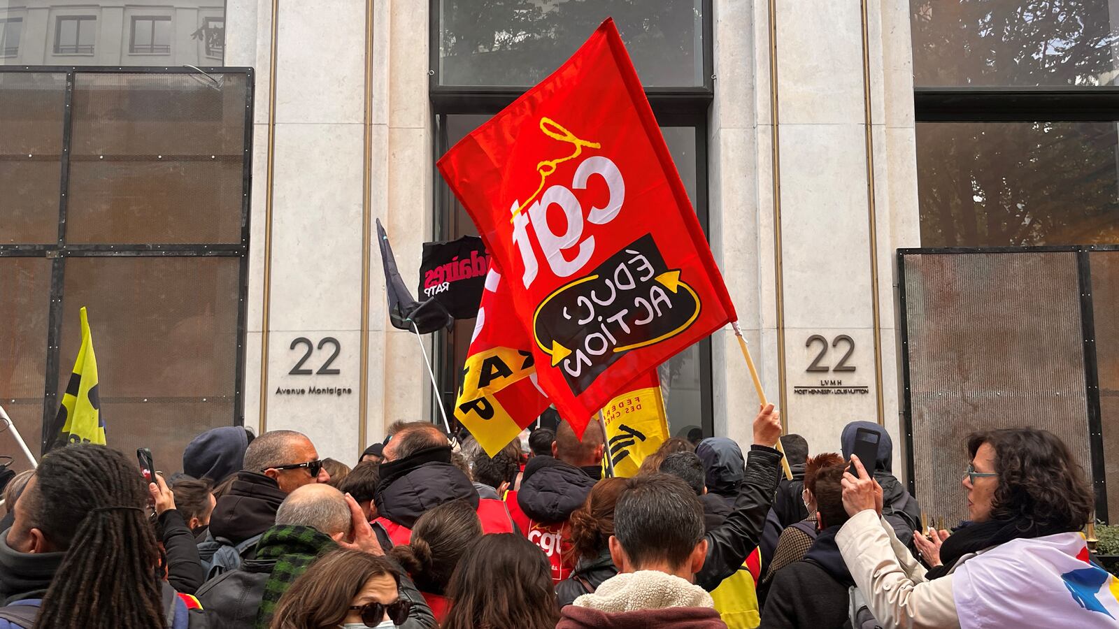 French SNCF workers, members of French CGT and Sud Rail labour unions enter the headquarters of luxury retailer Louis Vuitton during a demonstration in Paris.