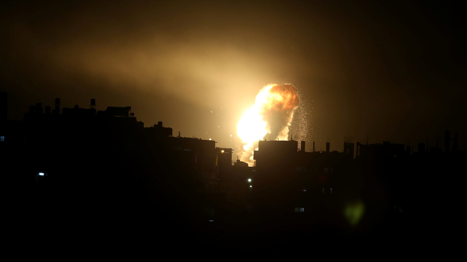 An explosion is seen during Israeli air strikes in the southern Gaza Strip