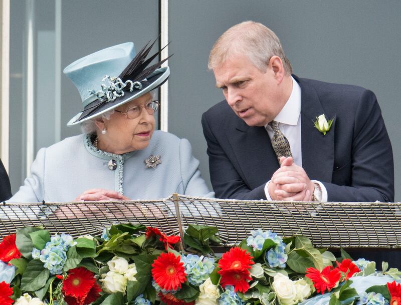 EPSOM, ENGLAND - JUNE 01:  Queen Elizabeth II and Prince Andrew, Duke of York watch the racing at The Investec Derby Festival at Epsom Racecourse on June 1, 2013 in Epsom, England.  (Photo by Mark Cuthbert/UK Press via Getty Images)
