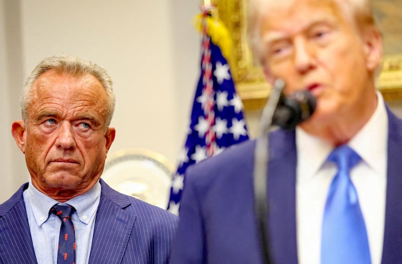 Secretary of Health and Human Services Robert F. Kennedy Jr. looks at U.S. President Donald Trump while he makes an announcement linking autism to childhood vaccines and to the use of popular pain medication Tylenol for pregnant women and children, claims which are not backed by decades of science, at the White House, in Washington, D.C., U.S., September 22, 2025.