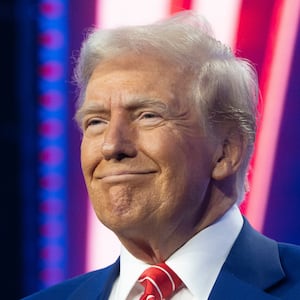 President-elect Donald Trump smiles during Turning Point USA's AmericaFest at the Phoenix Convention Center on December 22, 2024 in Phoenix, Arizona.