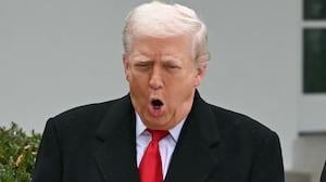 First Lady Melania Trump looks on as US President Donald Trump pardons Gobble, one of the National Thanksgiving turkeys, during the White House turkey pardon ceremony in the Rose Garden of the White House in Washington, DC on November 25, 2025.
