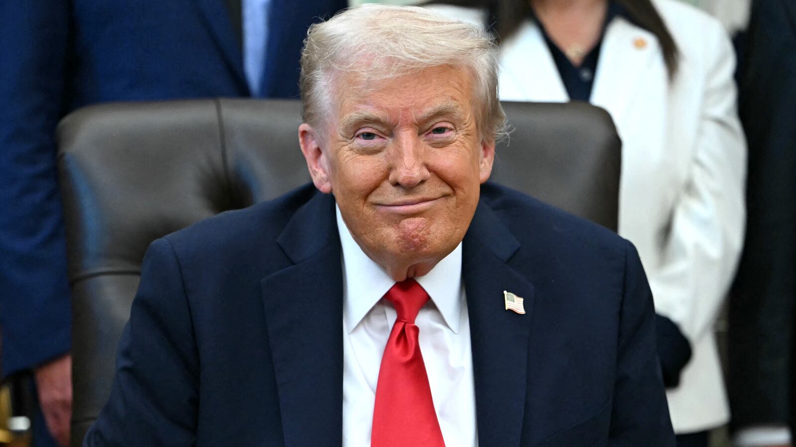 Donald Trump smiles during an announcement in the Oval Office of the White House in Washington, DC, on October 16, 2025.