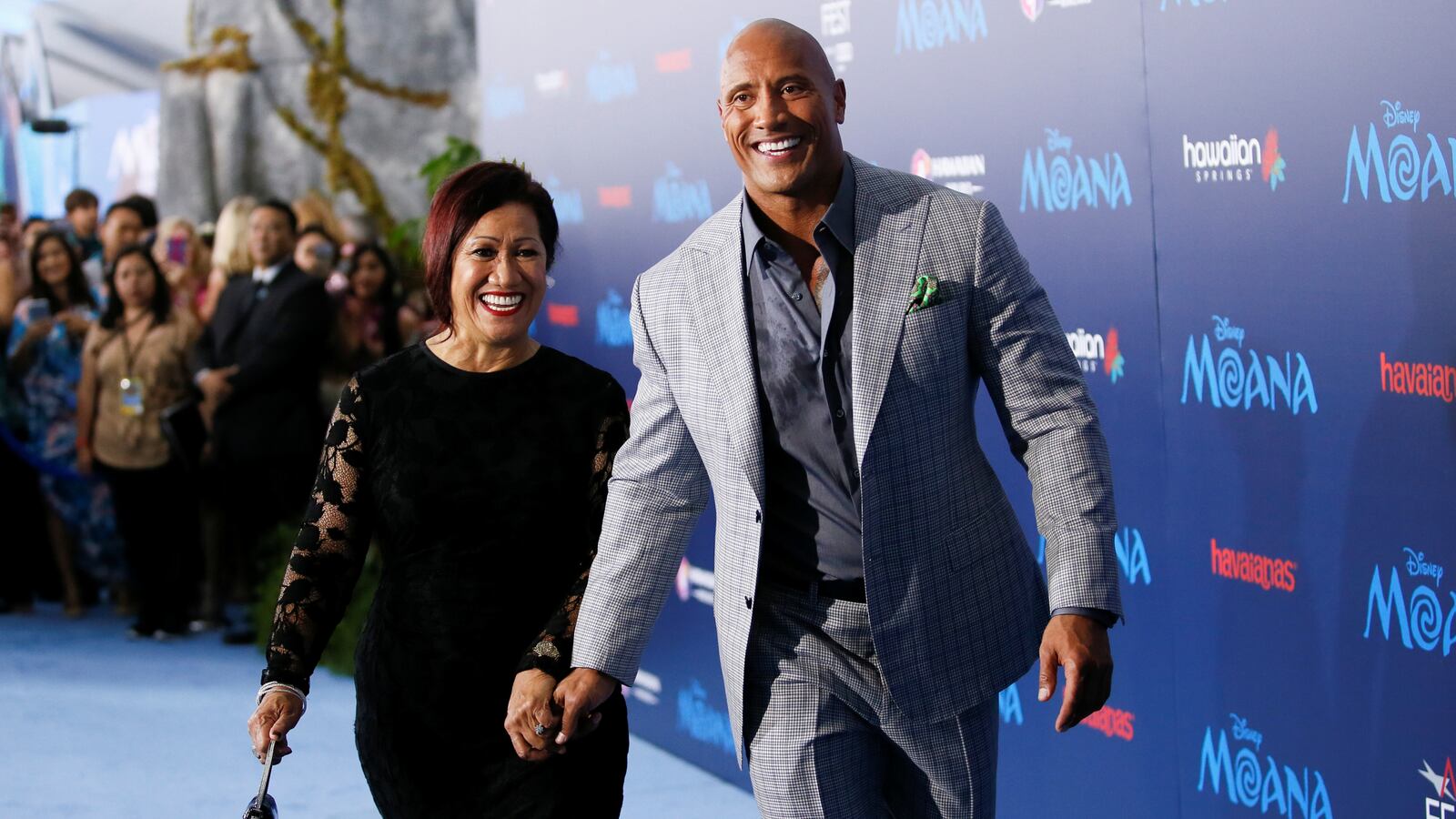 Dwayne Johnson and his mother, Ata Johnson, walk at the world premiere of “Moana” in November 2016.
