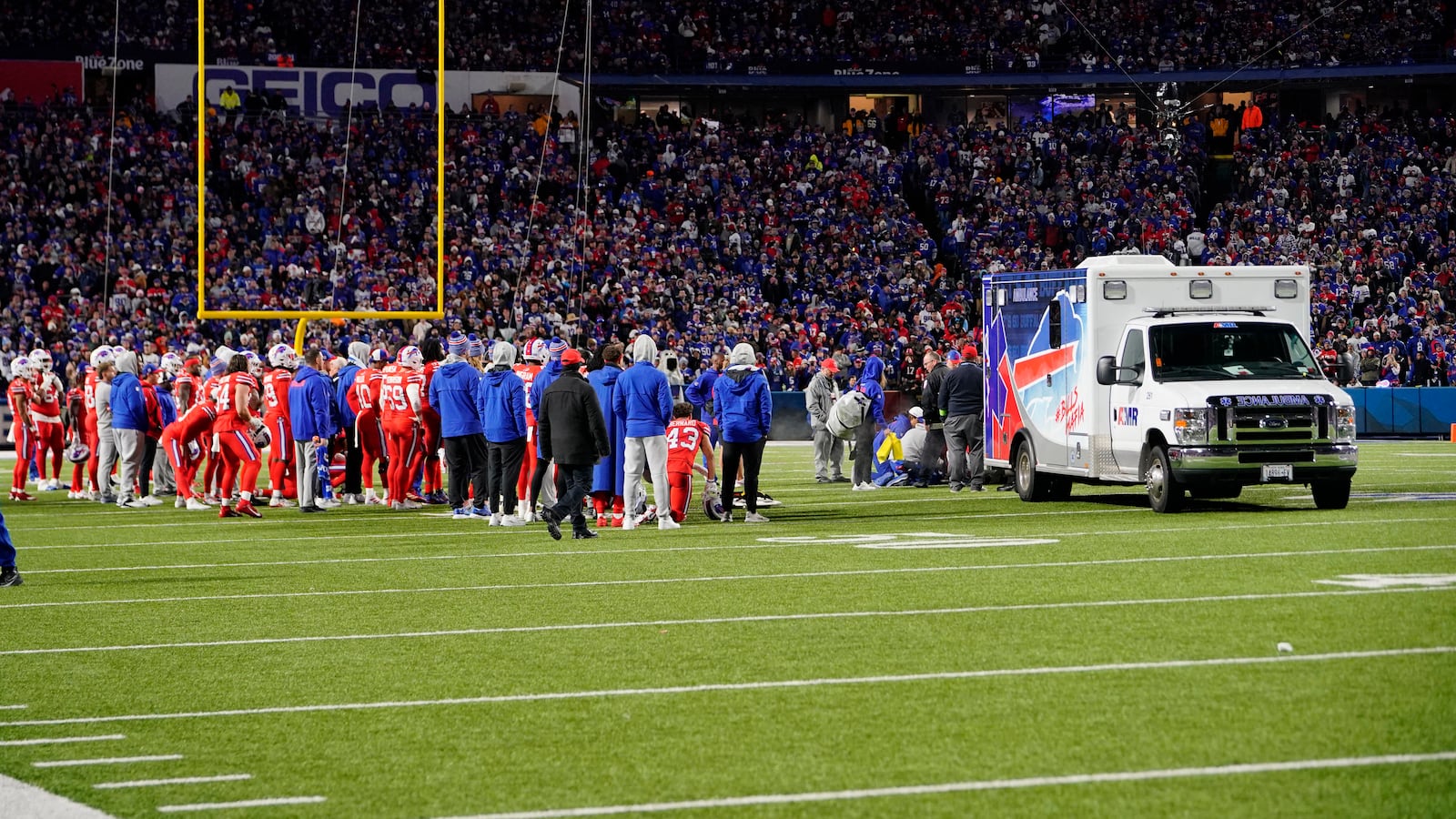 The Buffalo Bills watch running back Damien Harris (22), who was injured on the previous play against the New York Giants, being put into an ambulance.