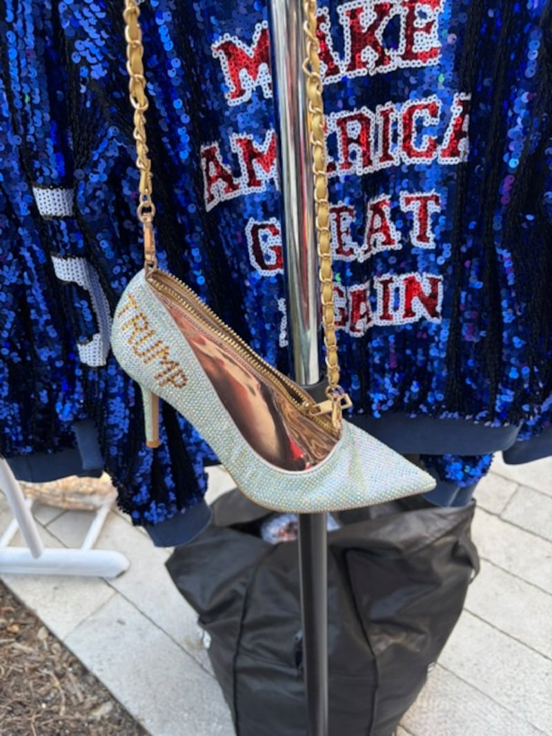 A bedazzled Trump stiletto purse on a gold chain outside the GOP midterm convention.