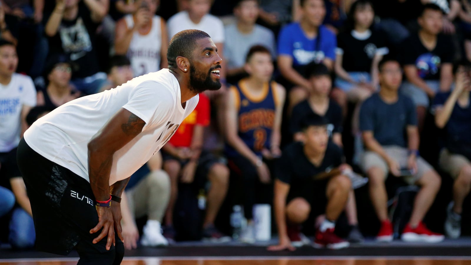 NBA player Kyrie Irving reacts during a promotional event in Taipei.
