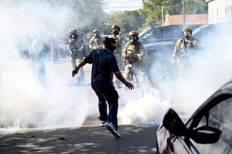 Residents and protesters clash with federal agents in the East Side neighborhood