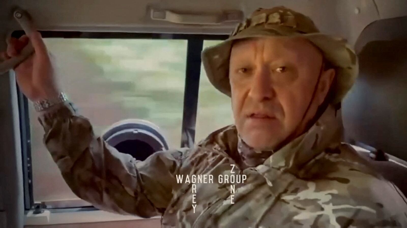 Yevgeny Prigozhin, chief of Russian private mercenary group Wagner, gives an address in camouflage inside a vehicle at an unknown location, in this still image taken from video possibly shot in Africa and published August 31, 2023.
