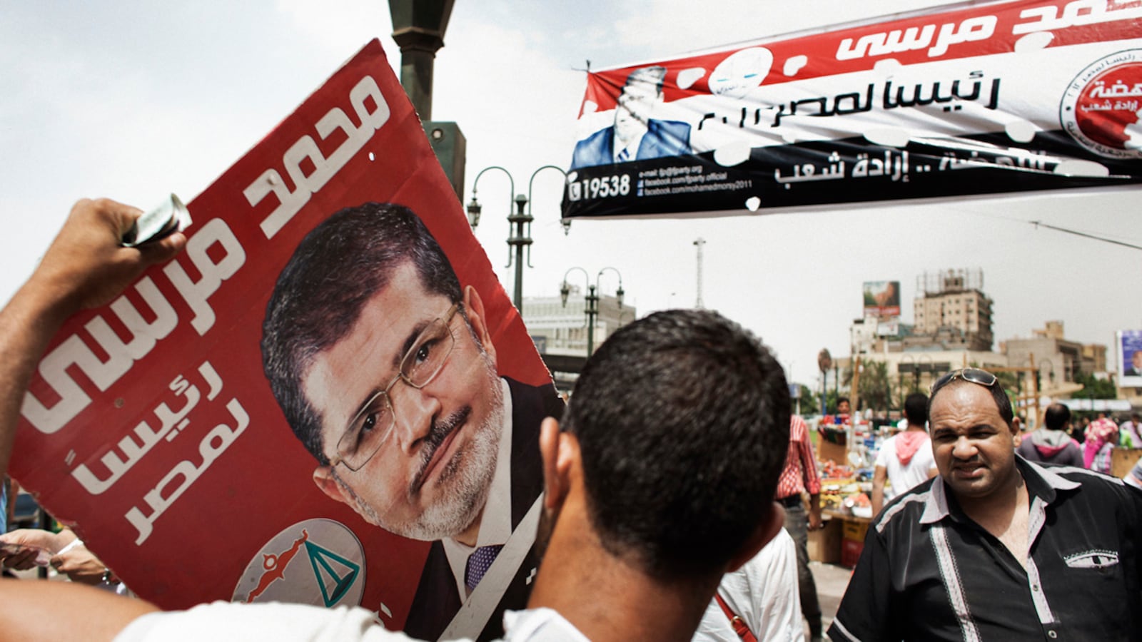 articles/2012/06/07/can-egypt-s-economy-turn-the-corner/egypt-elections-morsi-malik-tease_pedzhm