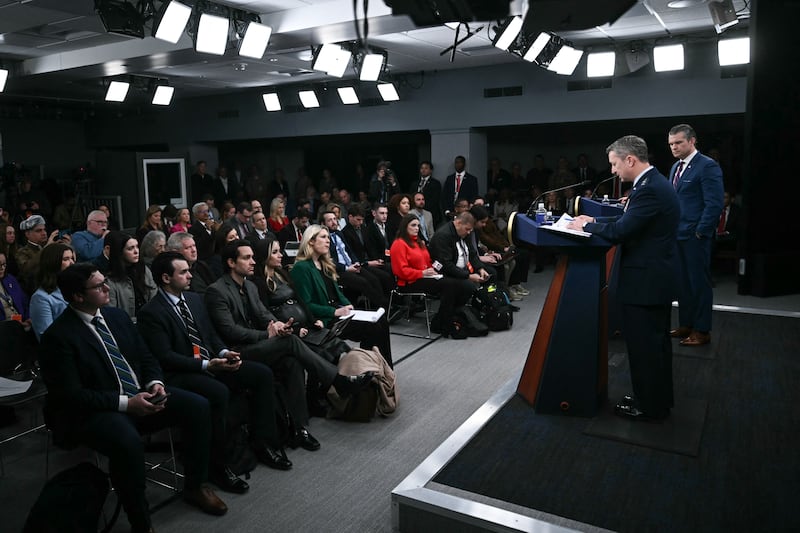 US Defense Secretary Pete Hegseth (R) and the Chairman of the Joint Chiefs of Staff General Dan Caine (2R) speak during a press conference on US military action in Iran, at the Pentagon in Washington, DC, on March 2, 2026. The United States hit hundreds of targets across Iran, and Israel expanded its bombing to Lebanon on Monday as President Donald Trump vowed to avenge the first US deaths in the war he launched to topple Tehran's ruling clerics. Iranian forces fired missiles and drones across the Middle East, killing people in Israel and the United Arab Emirates, in retaliation for the conflict that began February 28 with the death of Iran's supreme leader, Ayatollah Ali Khamenei. (Photo by Brendan SMIALOWSKI / AFP via Getty Images)