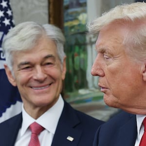 WASHINGTON, DC - SEPTEMBER 30: Pfizer CEO Albert Bourla speaks shakes hands with U.S. President Donald Trump as Centers for Medicare & Medicaid Services Mehmet Oz looks on after Trump announced a deal with Pfizer to lower Medicaid drug prices in the Oval Office of the White House on September 30, 2025 in Washington, DC. The Trump administration has reportedly reached an agreement with pharmaceutical company Pfizer to voluntarily sell its medications through Medicaid at lower prices (Photo by Win McNamee/Getty Images)