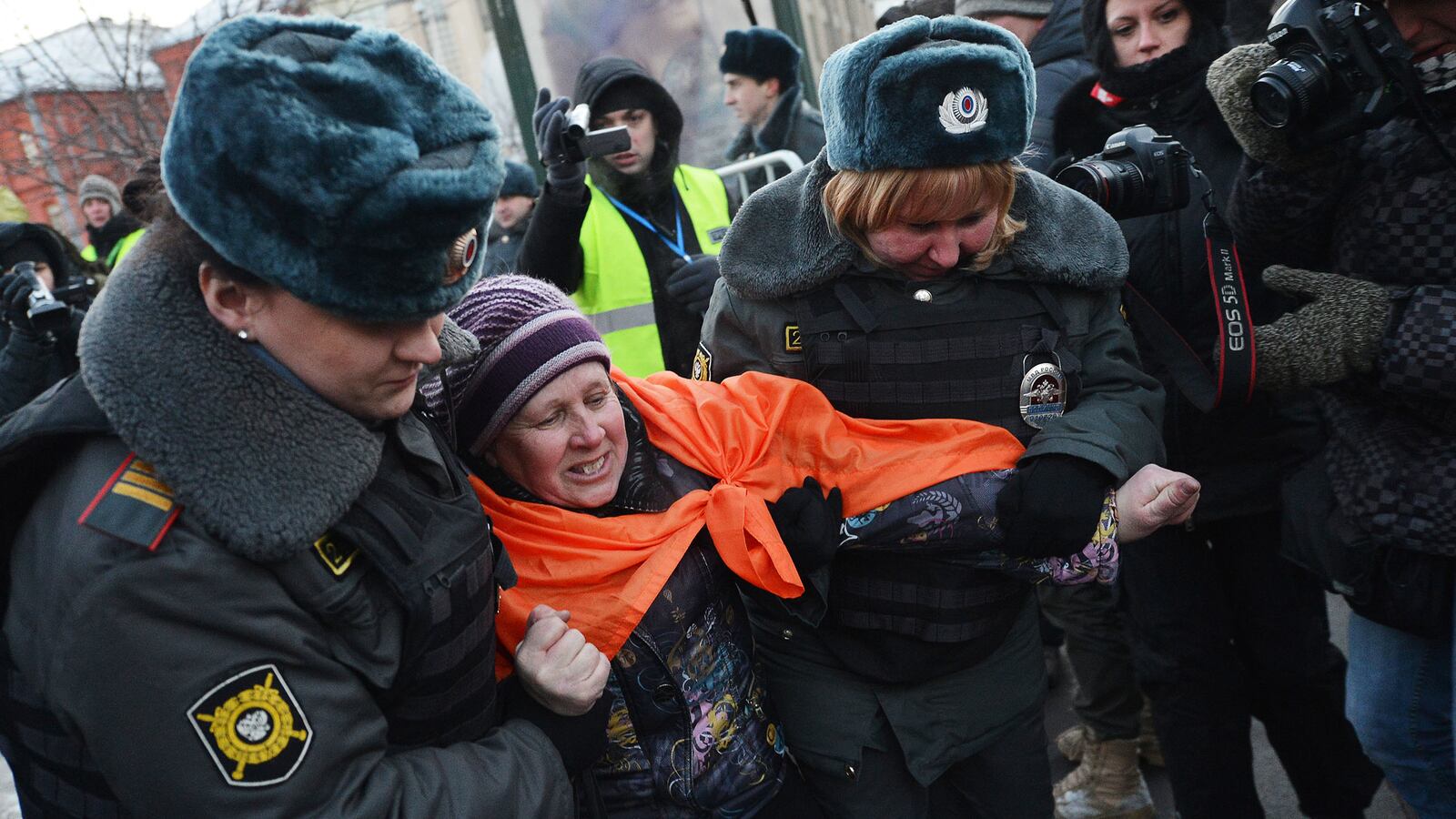 articles/2012/12/25/as-authorities-crack-down-activists-escape-from-russia/nemstova-russian-protest-tease_ickrkc