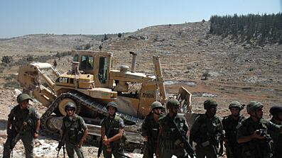 articles/2010/10/22/tearing-down-jerusalems-walls/olopade-budrus_135349_a9sipb