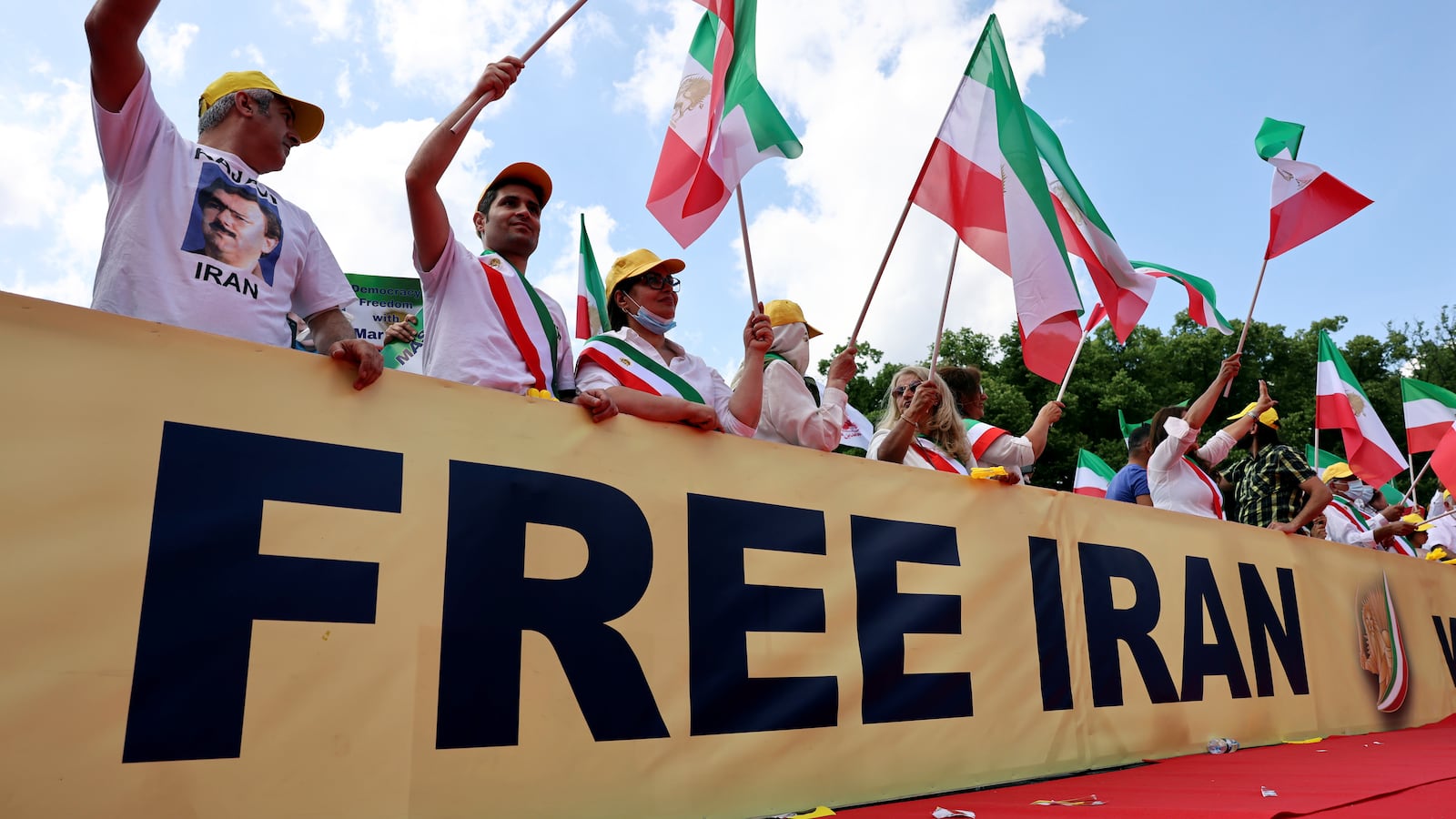Supporters of the National Council of Resistance of Iran (NCRI) gather to protest against the government in Tehran and the use of the death penalty in Iran
