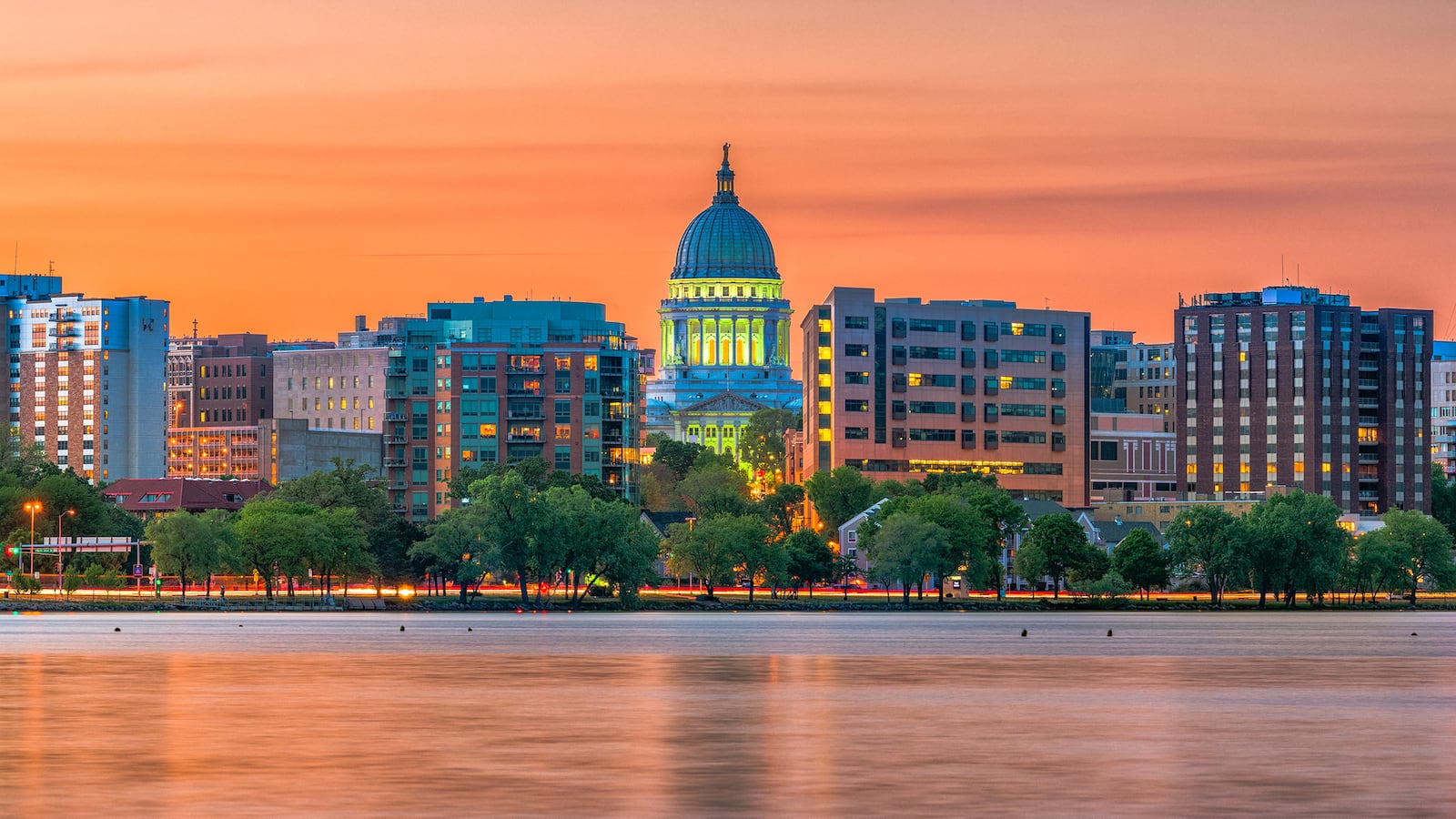 Madison, Wisconsin, USA downtown skyline at dusk on Lake Monona.