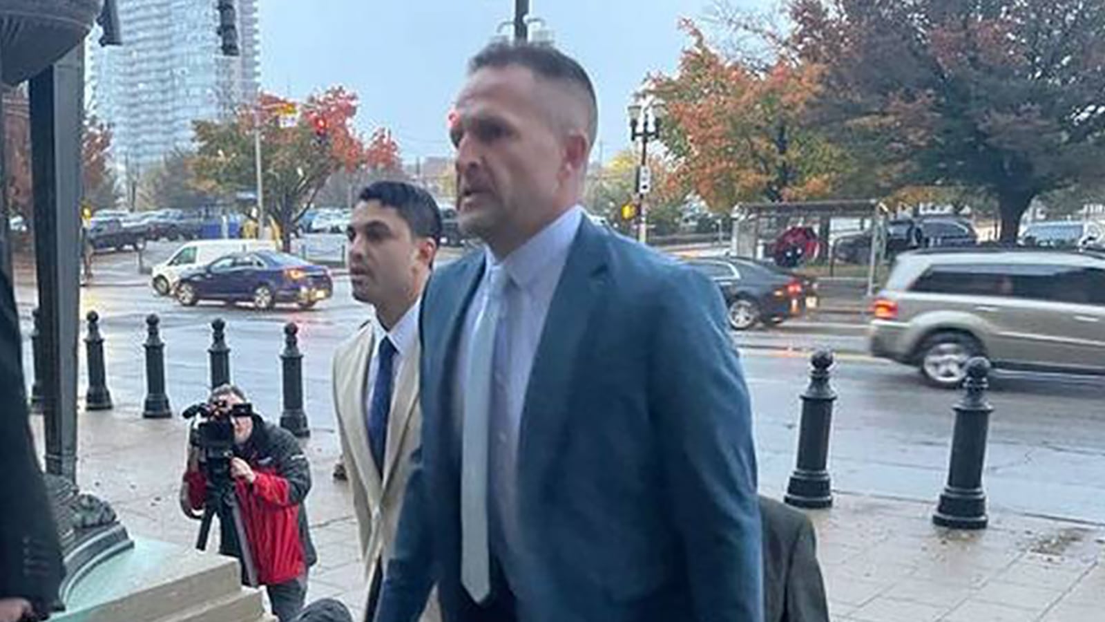 Brett Hankison, right, arrives in court on Oct. 30, 2023, alongside his attorneys for the beginning of his federal trial which will determine if he violated the civil rights of Breonna Taylor,