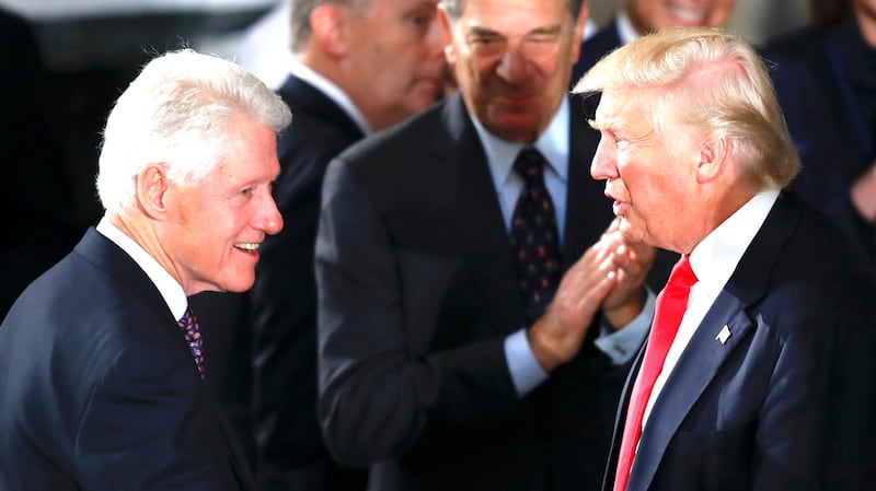 President Donald Trump and first lady Melania Trump greet former President Bill Clinton