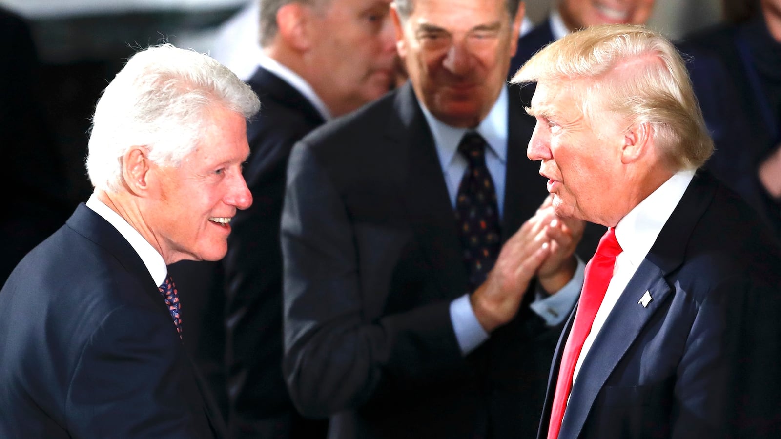 President Donald Trump and first lady Melania Trump greet former President Bill Clinton