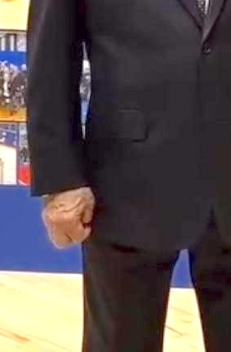 Close-up of Putin's hand.