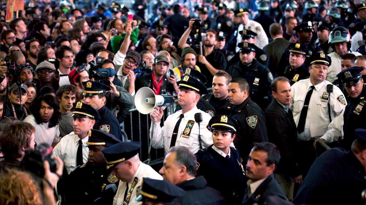 articles/2011/10/17/occupy-wall-street-coverage-photos-videos-update/occupy-wall-st-wrap_dwlxvw