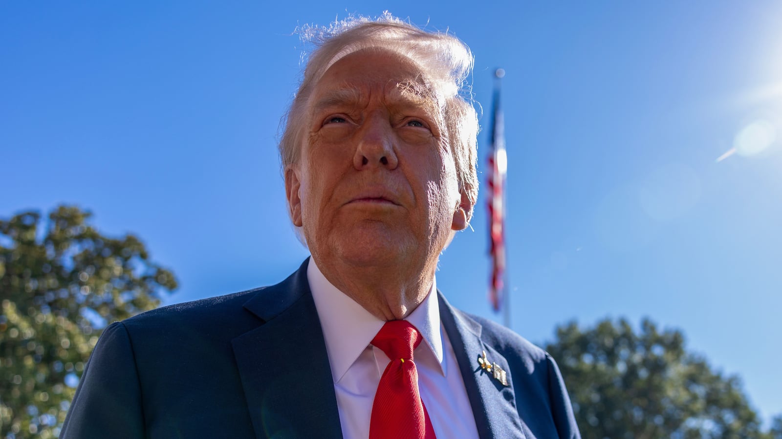 President Donald Trump talks to the media before heading to Marine One on the south lawn of the White House on October 05, 2025 in Washington, DC.