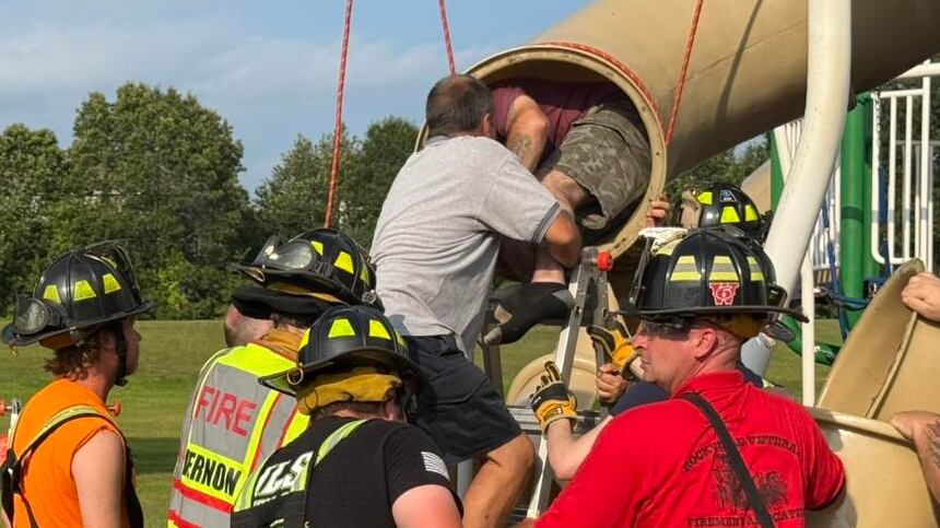 Rescuers pull the man from the severed tube