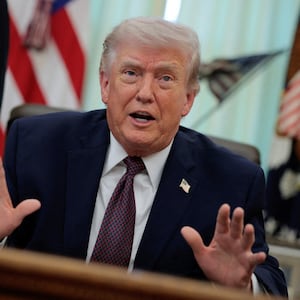 FILE PHOTO: U.S. President Donald Trump speaks during the signing ceremony for an executive order on mail ballots, in the Oval Office of the White House in Washington, D.C., March 31, 2026.  REUTERS/Evan Vucci/File Photo