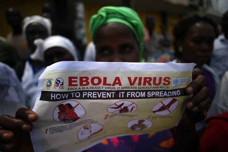 galleries/2014/10/23/portrait-of-an-epidemic-the-front-lines-of-ebola/141022-john-moore-ebola-03_yolo71