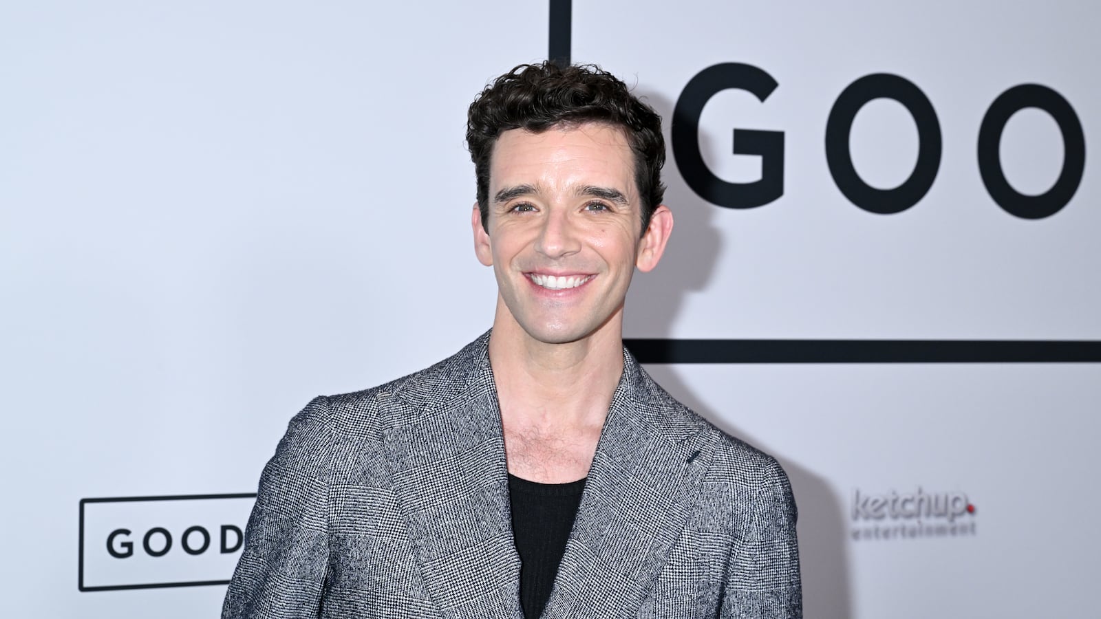 Michael Urie on a red carpet