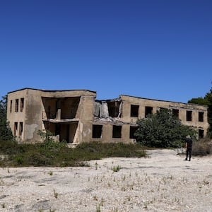 An abandoned ex-military command building on a hilltop on the island of Sazan, near the Albanian city of Vlore, on Mediterranean coast, on July 30 2024. 
