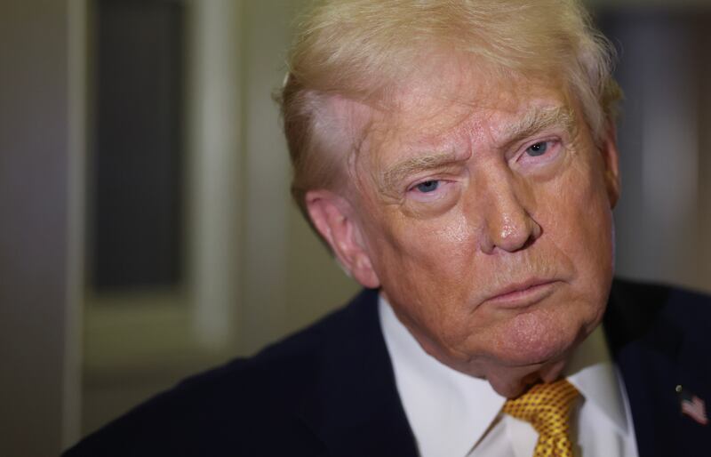 President Donald Trump speaks to the media aboard Air Force One en route to Washington, DC on January 04, 2026.