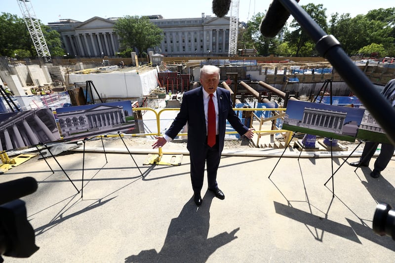 U..S. President Donald Trump gestures at the site of ongoing construction of the planned White House ballroom in Washington, D.C., U.S., May 19, 2026. REUTERS/Kevin Lamarque
