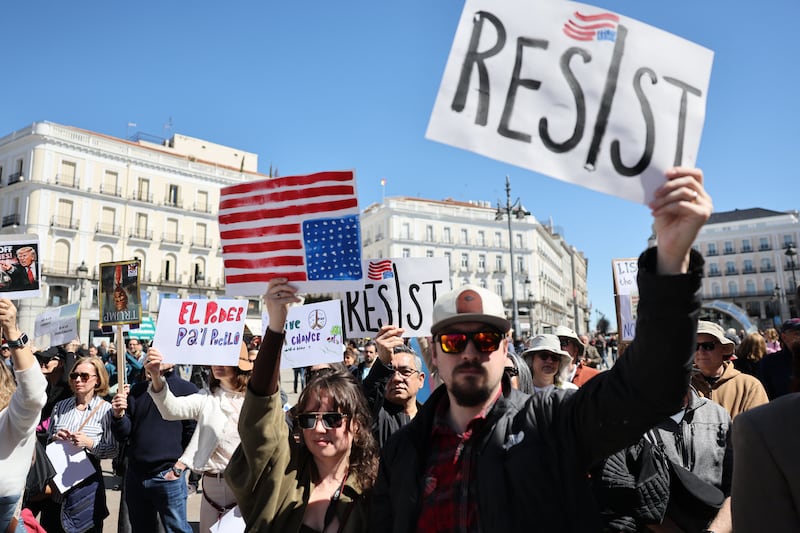 Demonstrators holding anti Donald Trump's policies placards take part in a 'No Kings Day' protest in Madrid on March 28, 2026. The "No Kings" movement is a coalition of grassroots groups that has originally emerged in the United States as the biggest voice of national outrage against Trump since he began his second term in January 2025. (Photo by Thomas COEX / AFP via Getty Images)