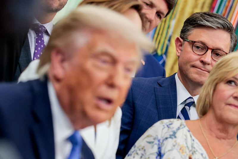 U.S. House Speaker Mike Johnson (R-LA) looks at U.S. President Donald Trump speaking in the Oval Office as Trump signs the Secure America Act, at the White House in Washington, D.C., U.S., June 10, 2026. REUTERS/Evan Vucci
