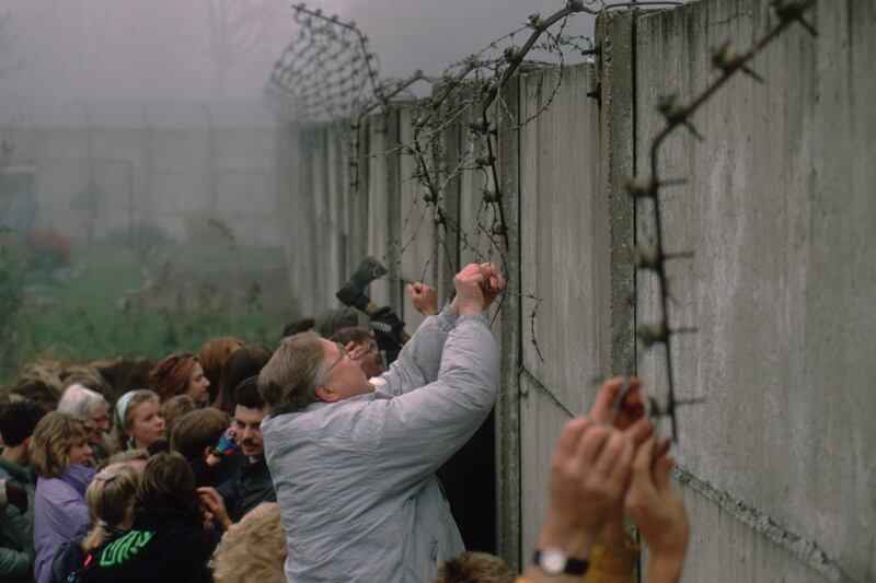 galleries/2014/11/07/a-wall-falls-and-a-cold-war-ends-photos/141107-berlin-wall5_tbcuqv
