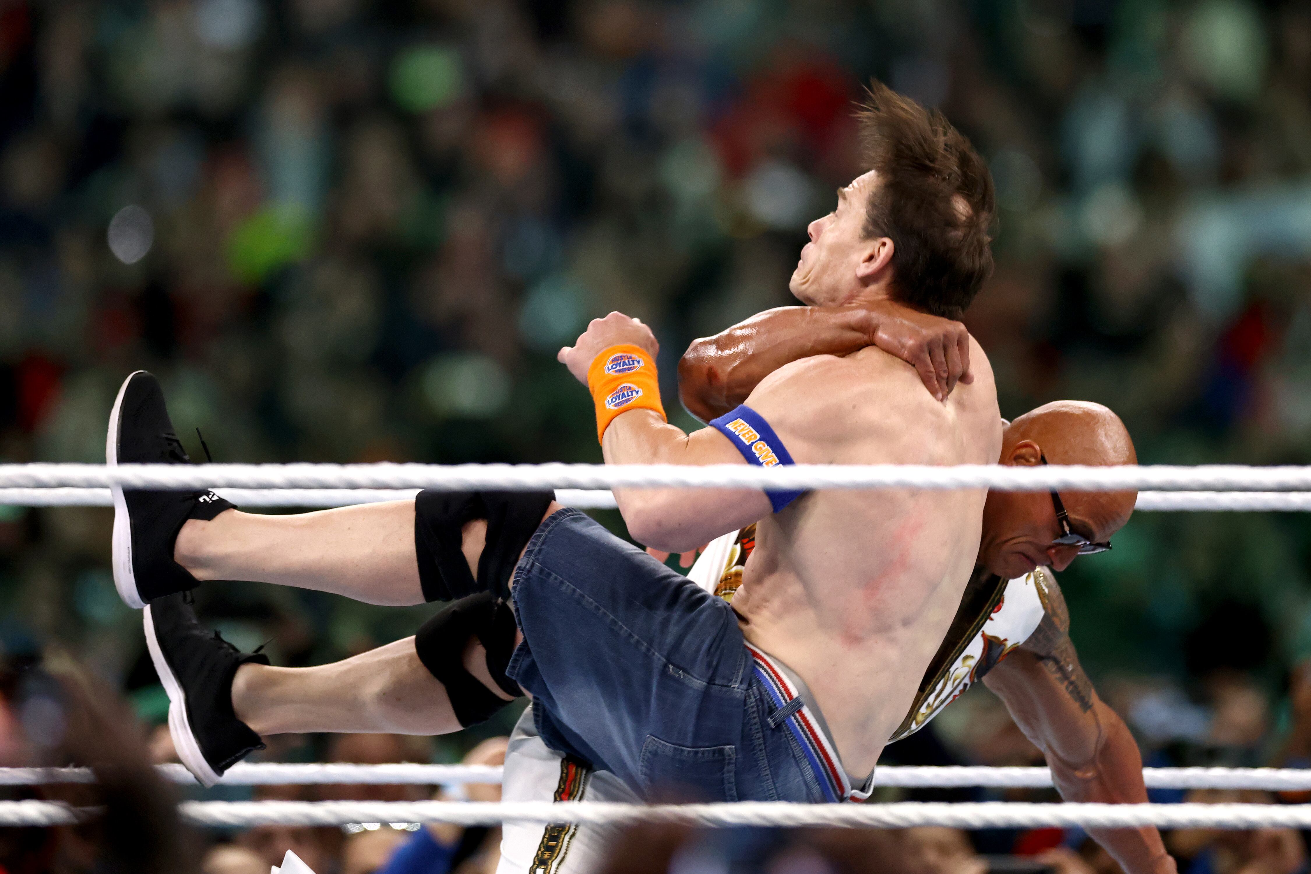 PHILADELPHIA, PENNSYLVANIA - APRIL 07: Dwayne "The Rock" Johnson and John Cena fight during Night Two at Lincoln Financial Field on April 07, 2024 in Philadelphia, Pennsylvania. (Photo by Tim Nwachukwu/Getty Images)