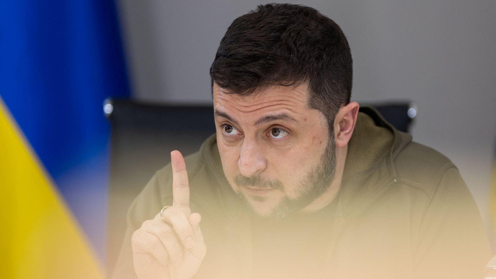 Ukraine's President Volodymyr Zelensky raises finger while talking.
