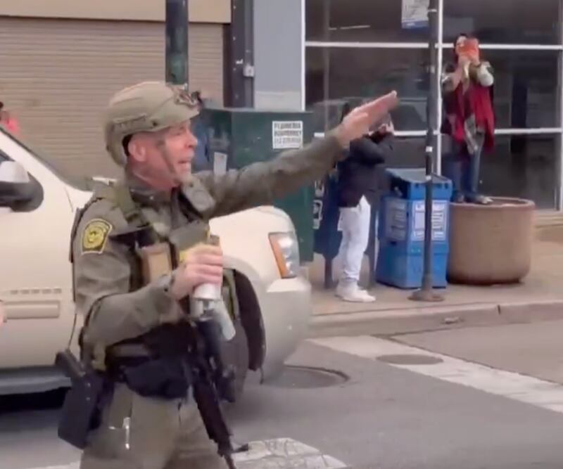 Gregory Bovino signals to protesters during the clash in Cicero, Illinois, on November 8, 2025.