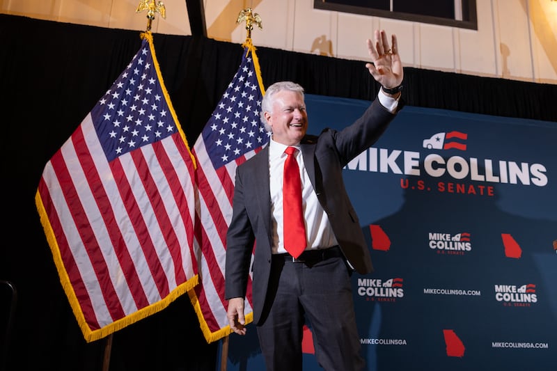 GOP Rep. Mike Collins waves at his supporters after securing the Republican Senate nomination on June 16, 2026 in Jackson, Georgia.