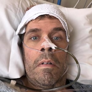 Perez Hilton in a hospital bed.