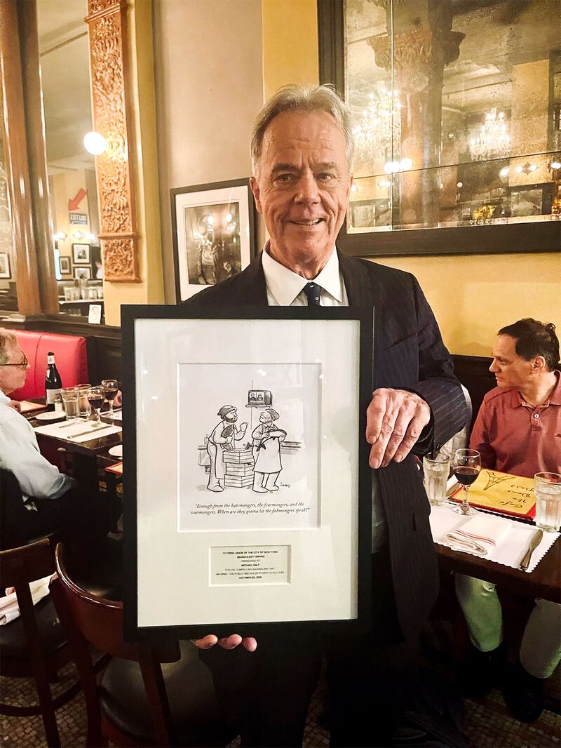 Michael Daly of the Daily Beast holds his Searchlight Award, honoring him as "the sole and conscience of New York journalism."
