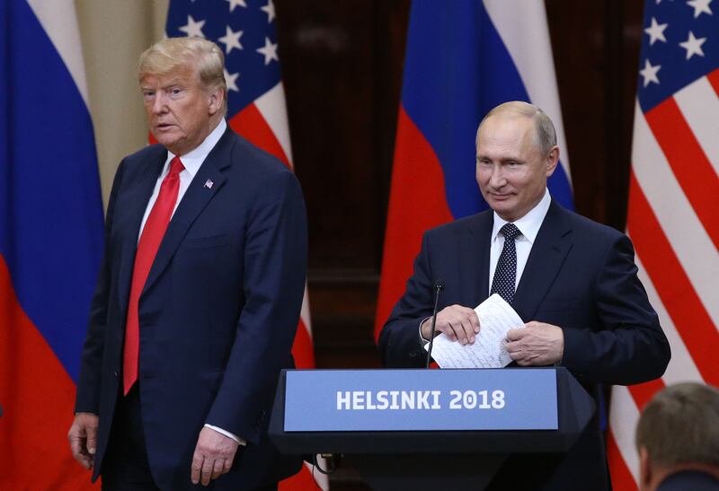President Donald Trump (L) and Russian President Vladimir Putin arrive for a joint press conference after their summit on July 16, 2018 in Helsinki, Finland.
