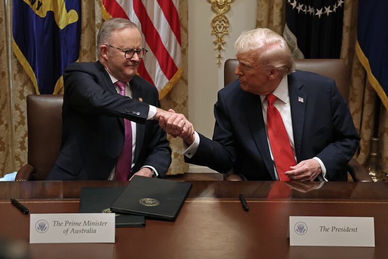WASHINGTON, DC - OCTOBER 20: Prime Minister of Australia Anthony Albanese (L) and U.S. President Donald Trump shake hands after signing a $8.5 billion rare earth minerals agreement during a bilateral meeting in the Cabinet Room of the White House on October 20, 2025 in Washington, DC. Albanese is visiting the U.S. Capital to meet with President Trump and later visit the Pentagon. (Photo by Anna Moneymaker/Getty Images)
